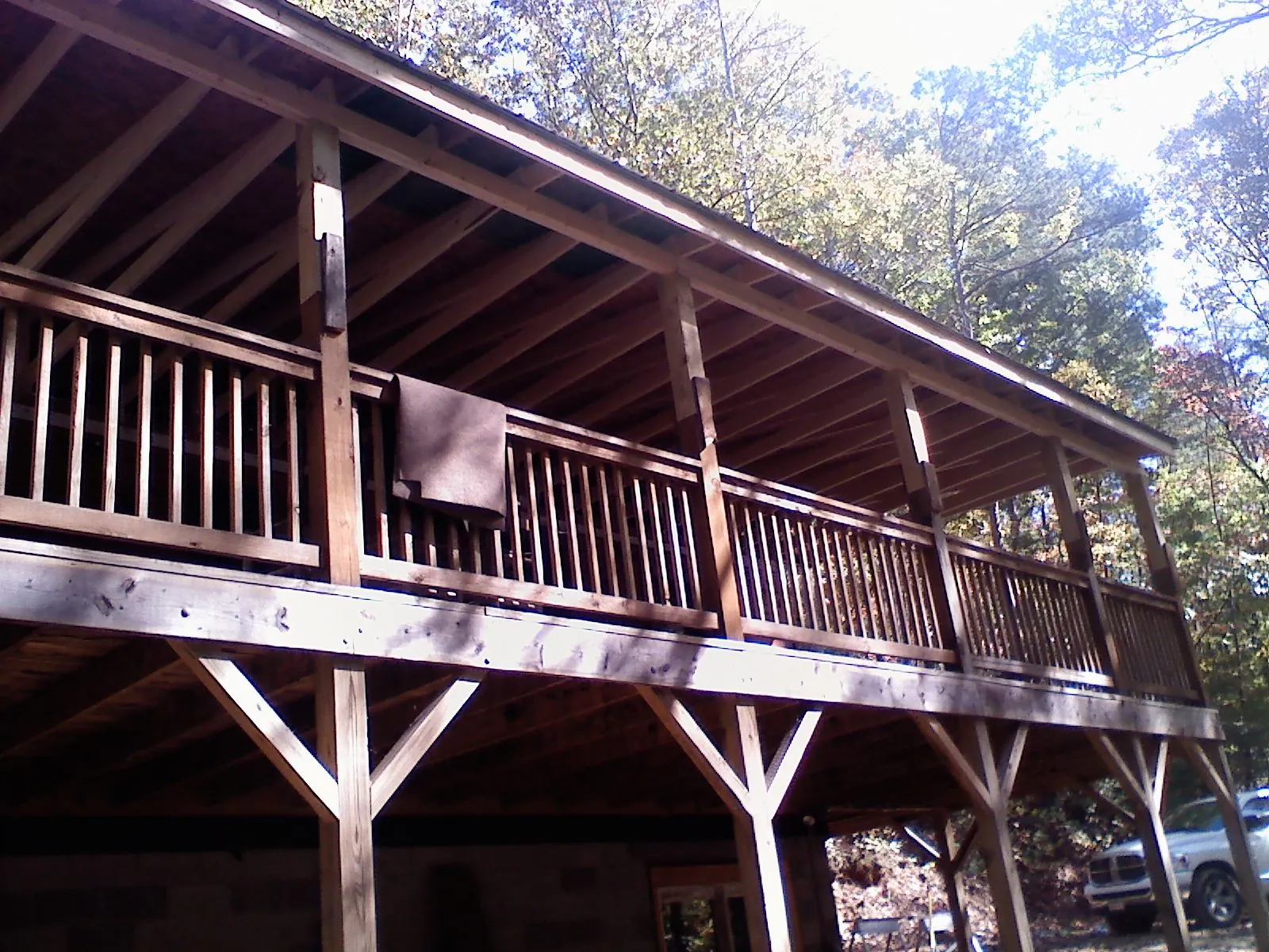 Timber framing under a new elevated porch and deck — Roof Leak Repair in Estes Park by Roofing Brothers